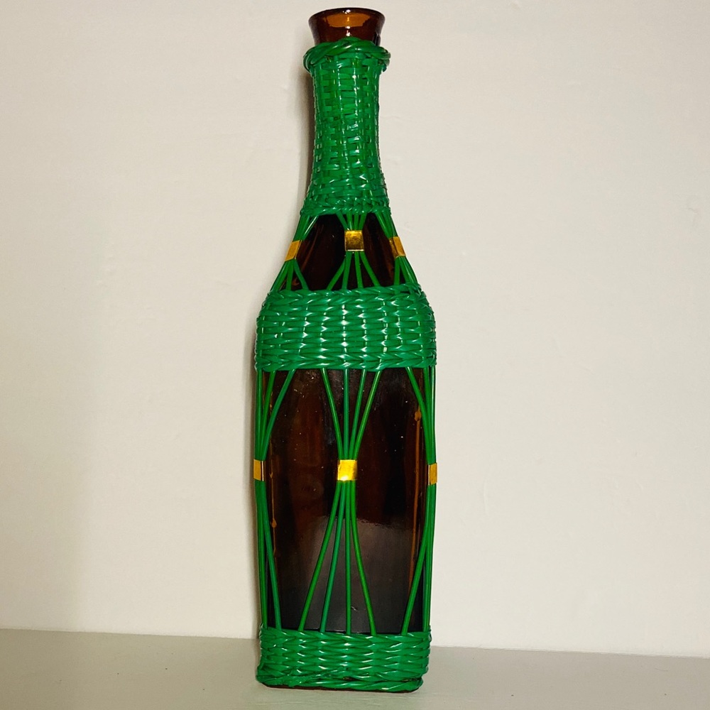 AMBER GLASS BOTTLE with wicker cover